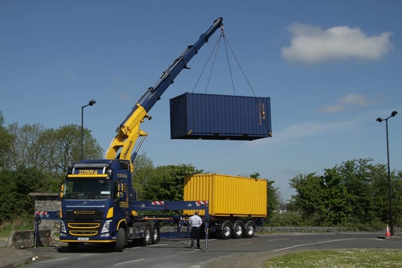 titan containers delievery container in the air lift
