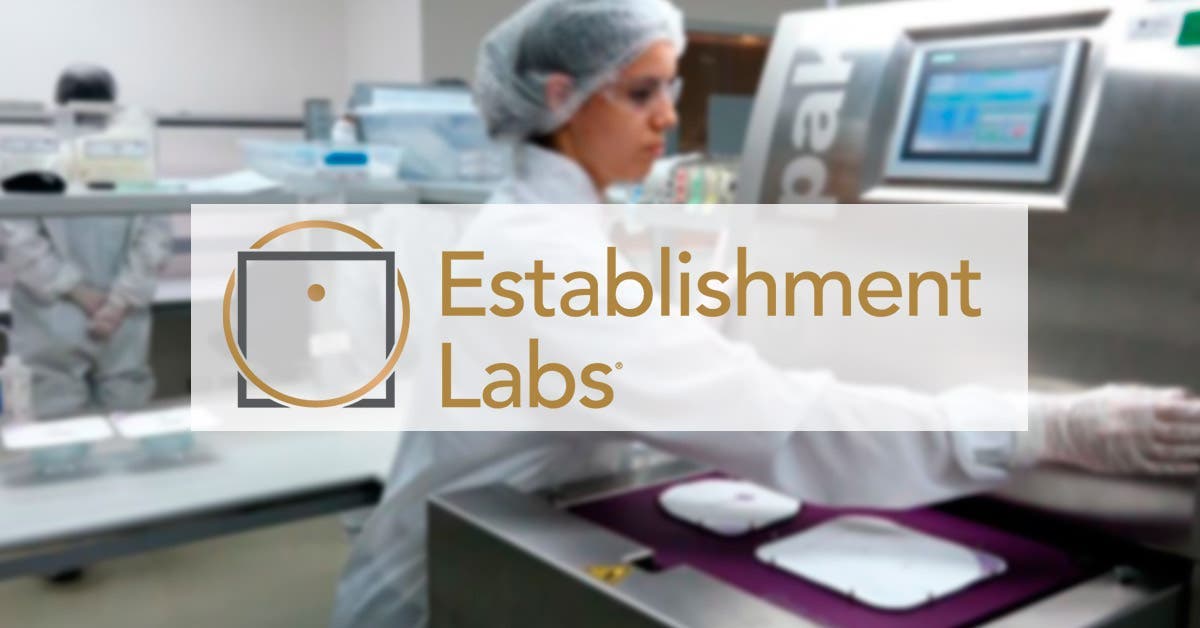 Establishment Labs Holding logo is displayed in ochre and grey on a blurred image background, which shows a girl dressed in a lab coat examines something