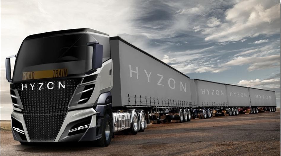 The picture shown Grey and black hydrogen fuel-cell truck from Hyzon Motors with a blue and white foggy sky background.