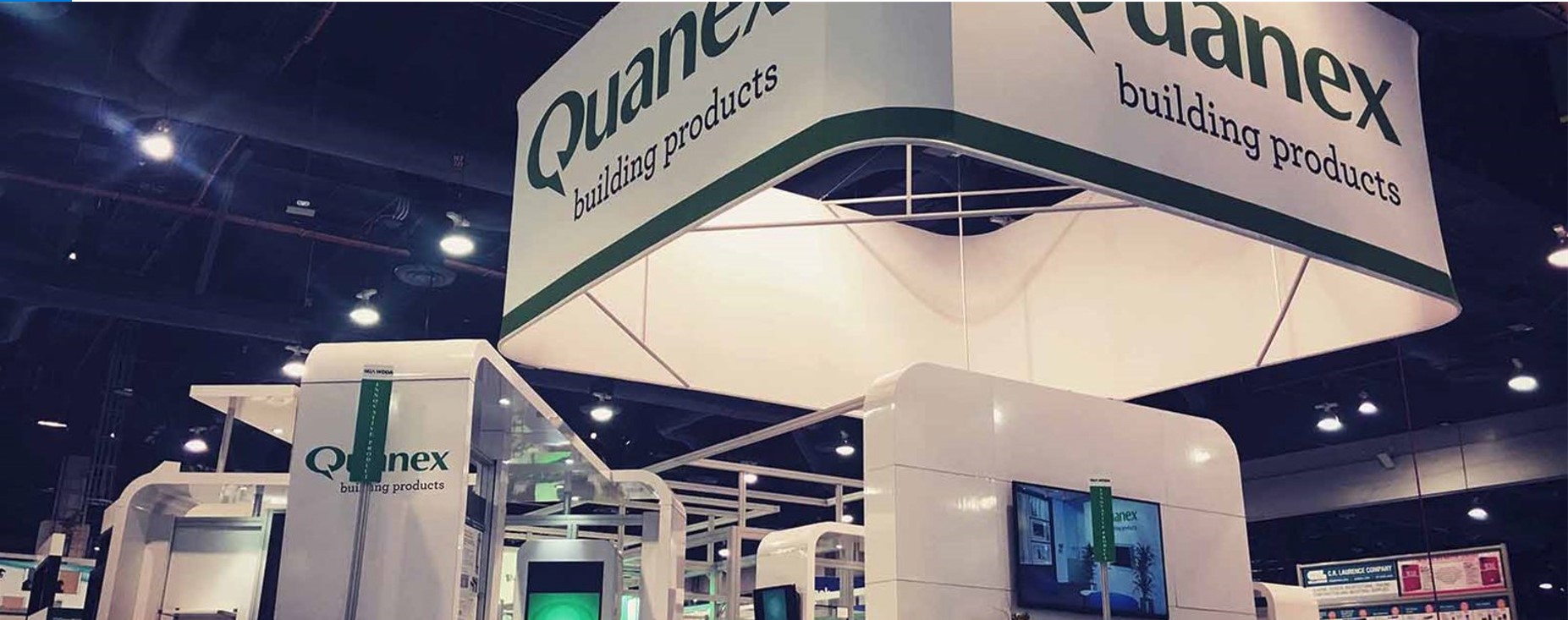 Quantex displays and advertises its services in a customized kiosk at an exhibition.