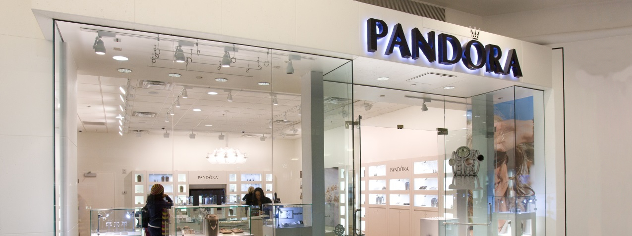 The image depicts a Pandora jewellery store that is beautifully designed.