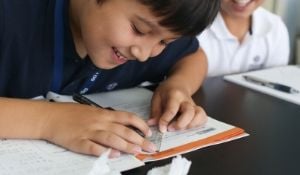 Collaboration, significant student engagement, and joy are prevalent in an American classroom.