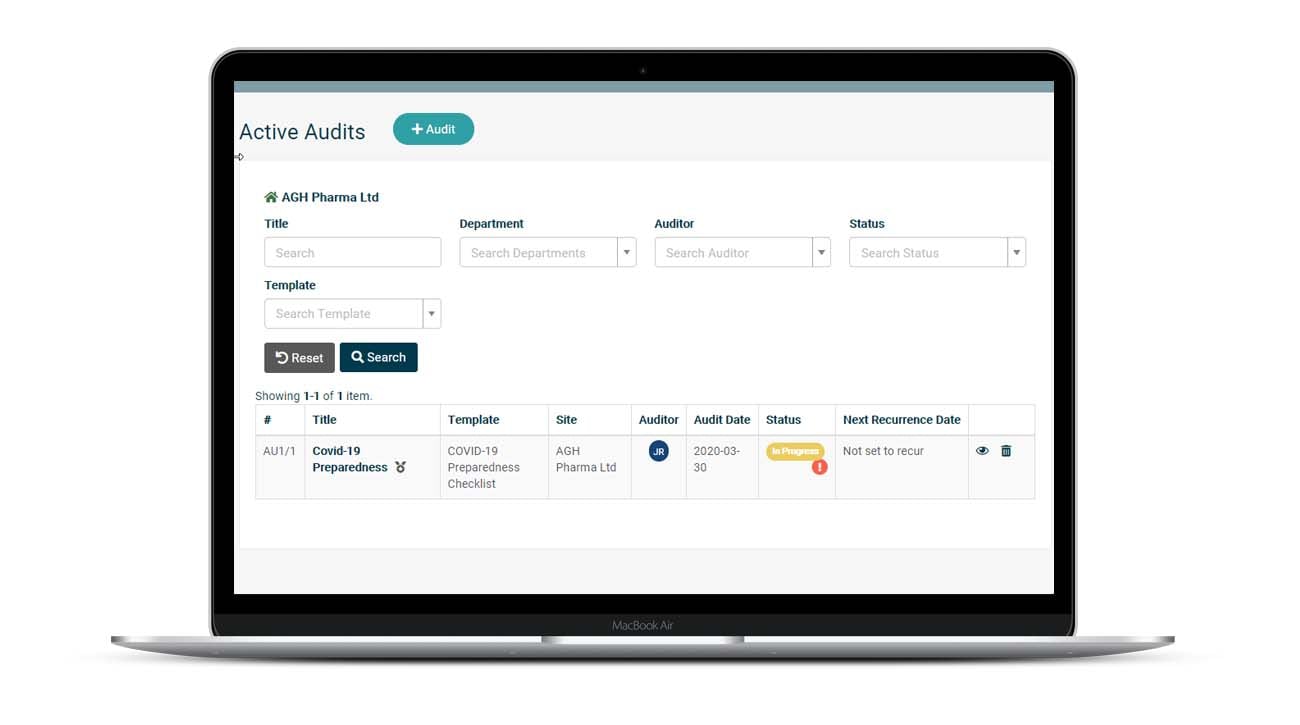 Laptop open showing Saas software with audits and inspections template on the screen