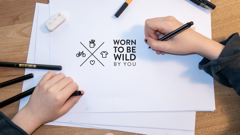 WORN TO BE WILD by woom Logo