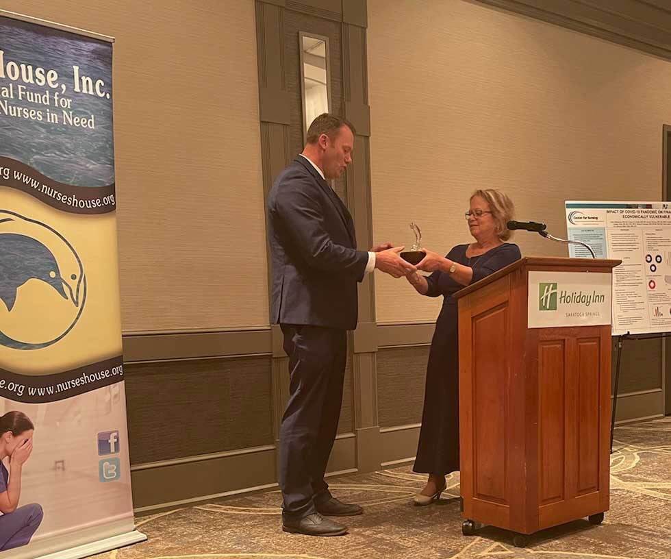 (Left to Right) David Theobald receiving the Dolphin Award from Ilene Sussman, RN, Nurses House President.