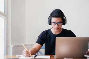 young-man-study-home-using-laptop-learning-online