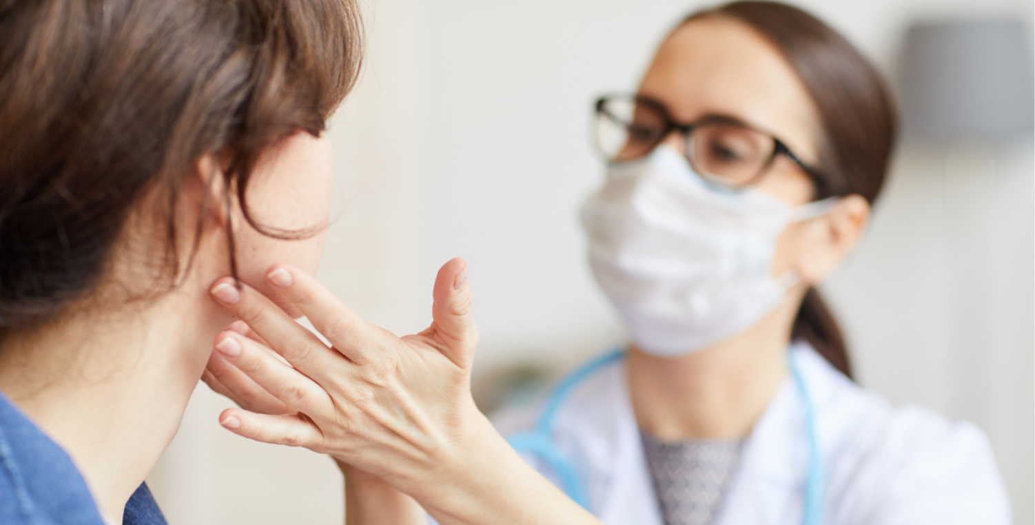 doctor examining patient