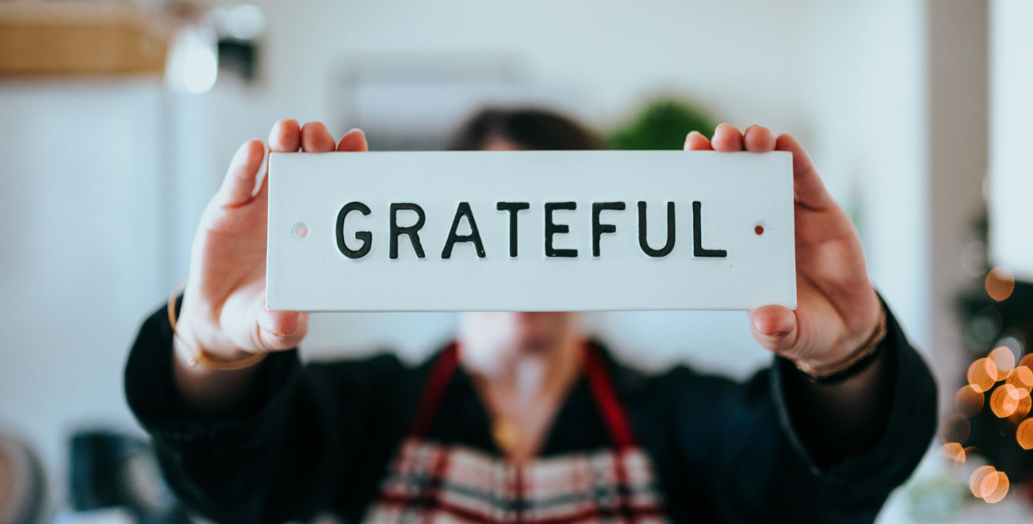 person holding grateful sign