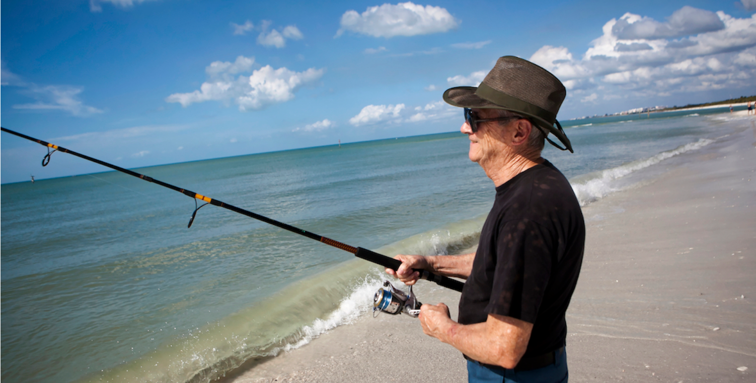 man fishing on florida beach
