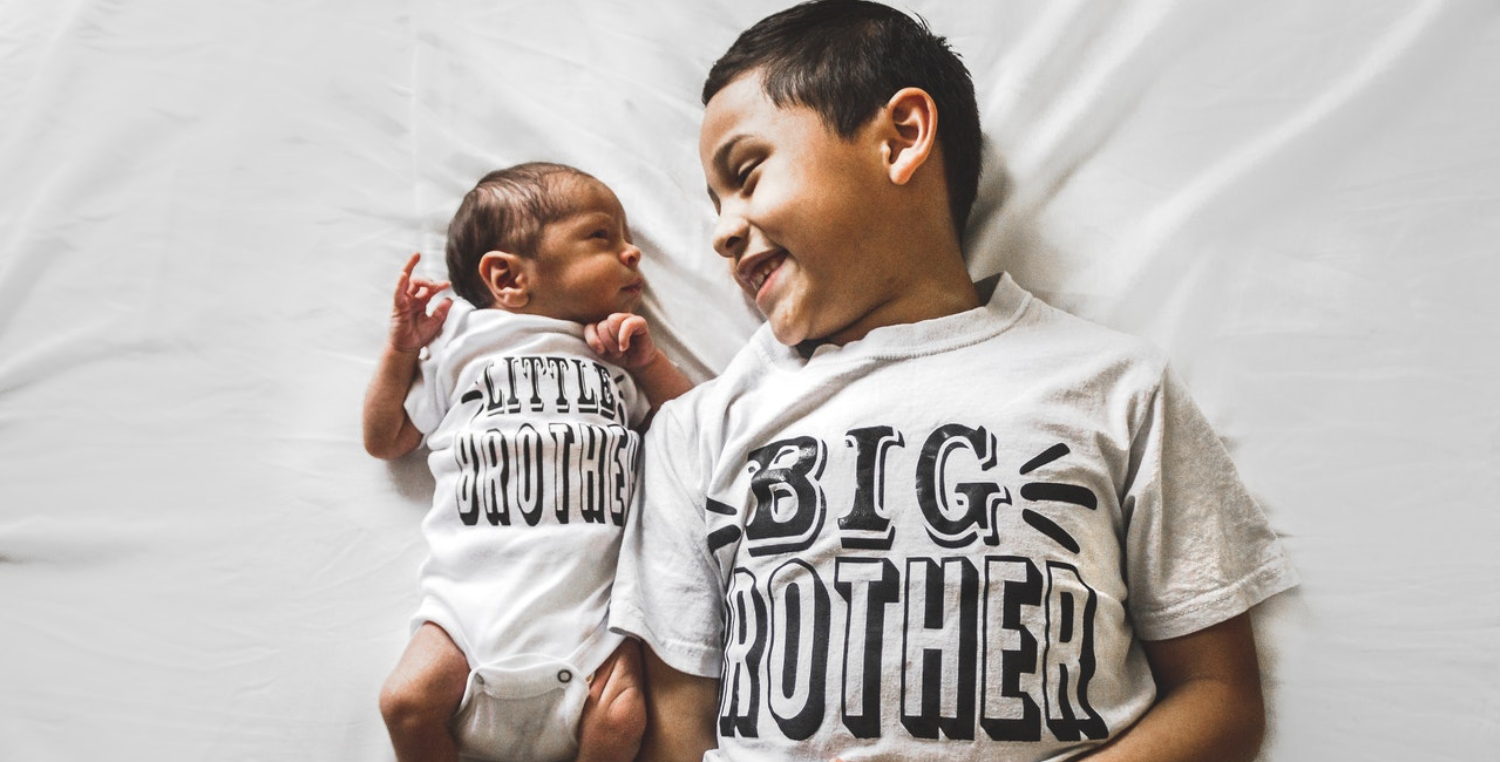newborn baby brother with big brother