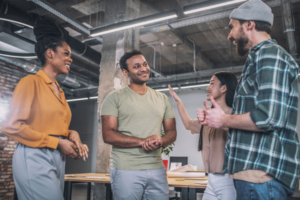 interracial-young-happy-colleagues-communicating