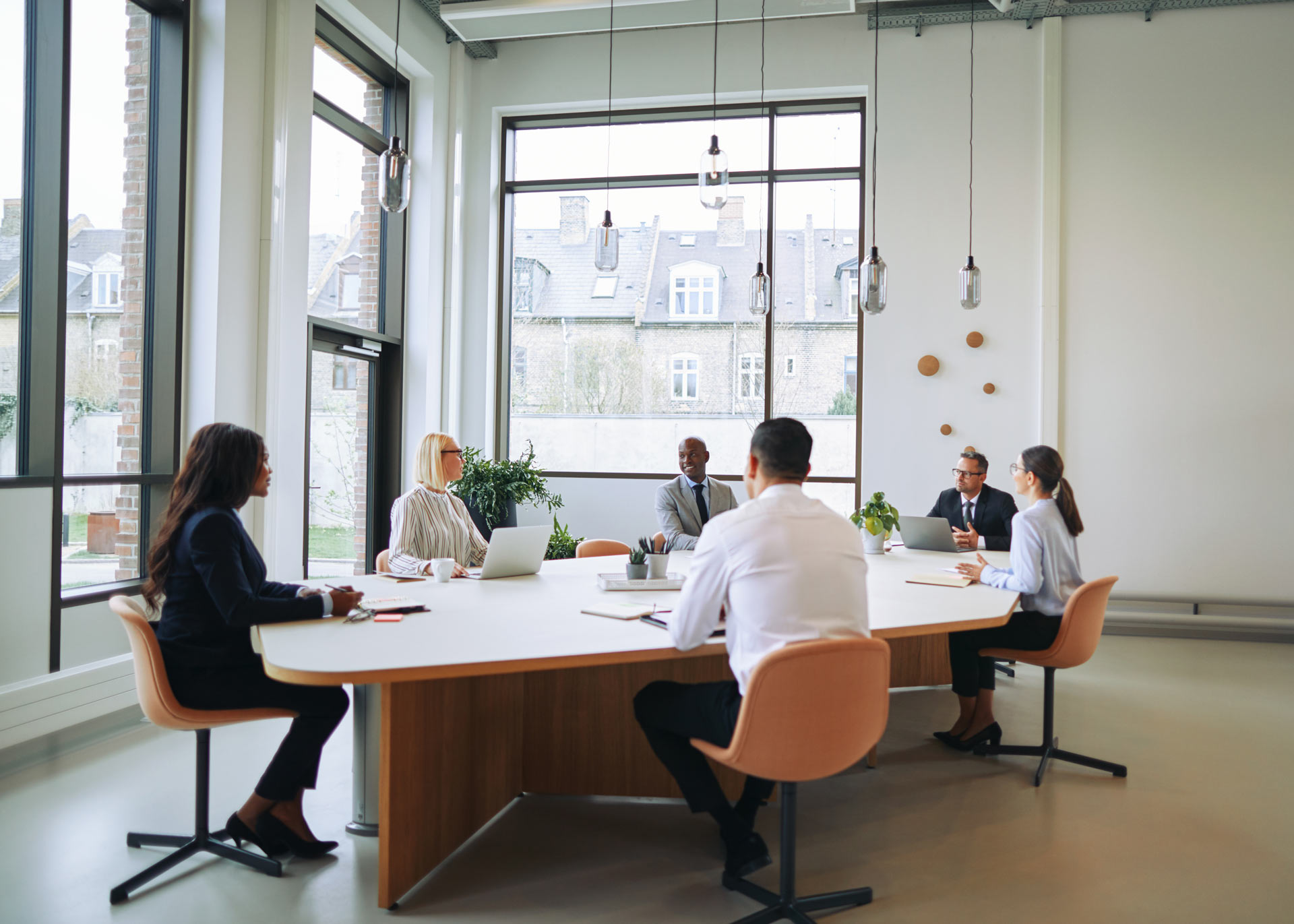 diverse-group-of-smiling-businesspeople-having-a-meeting