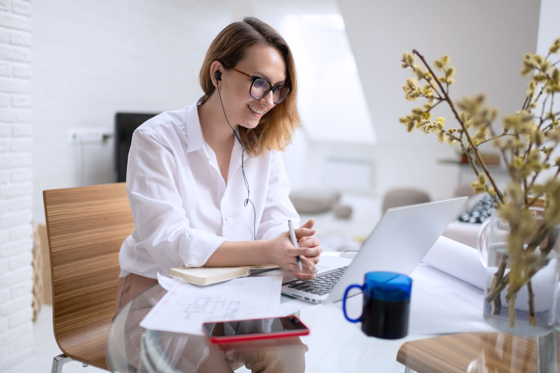 positive-female-architect-discussing-project-with