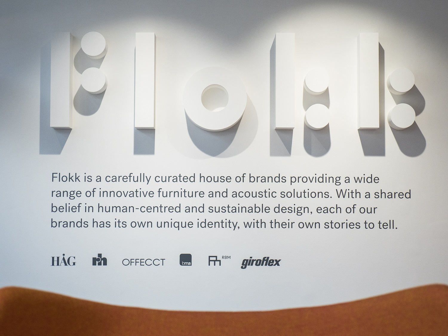 UK Flokk showroom with Flokk mission statement on wall