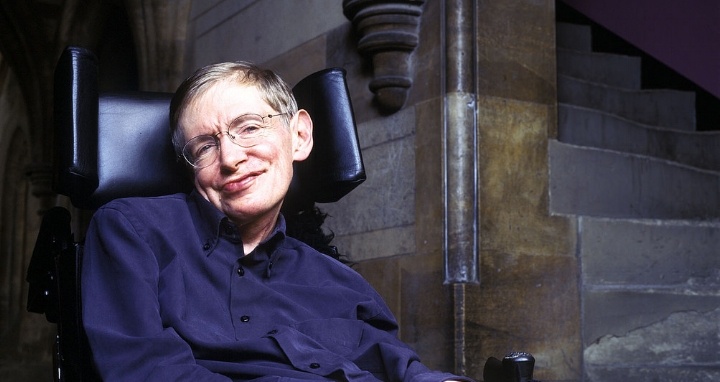 Stephen Hawking seated intellectual genius