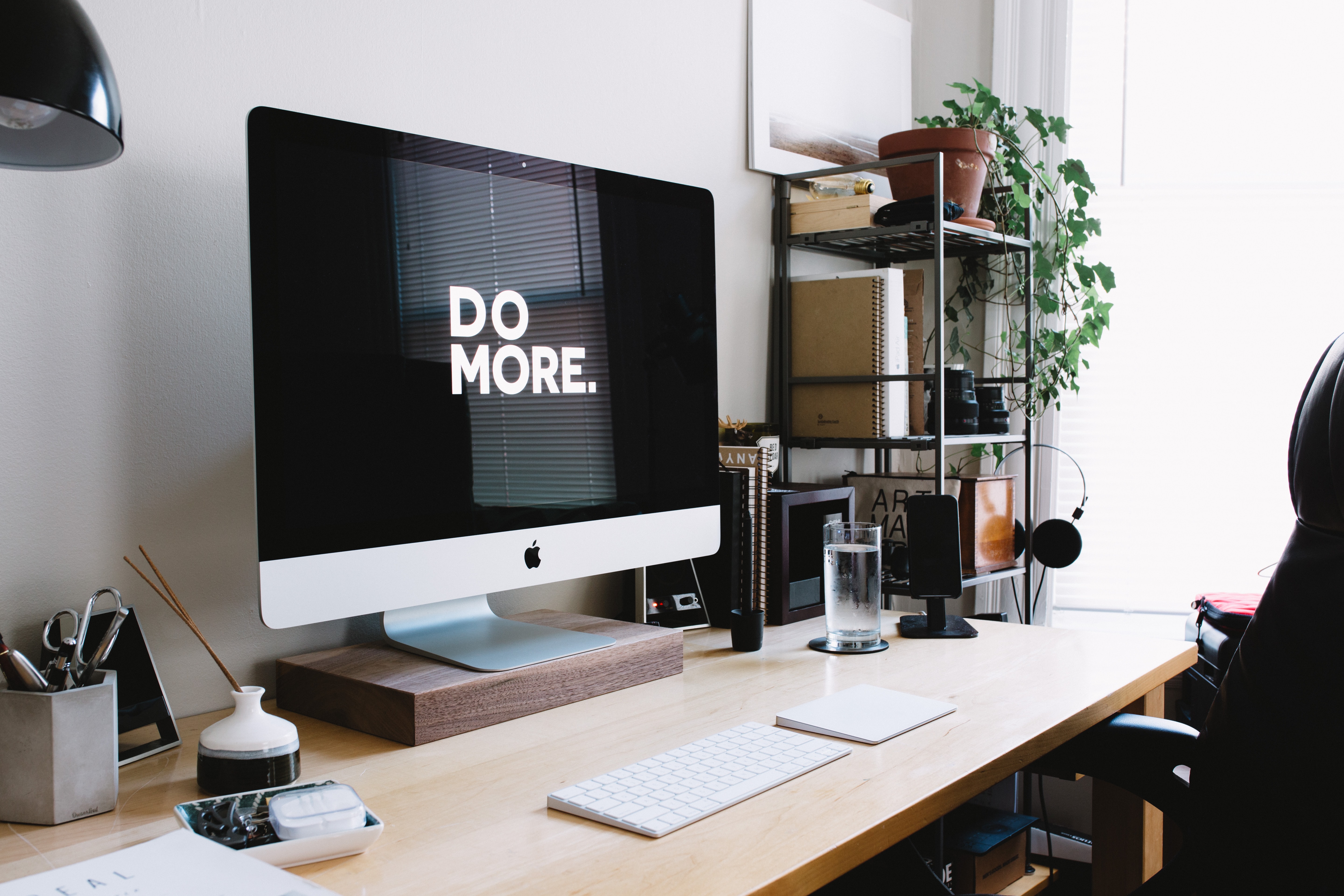 Desk computer with quote "Do More"