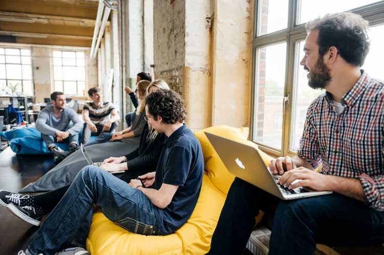 people sitting together and talking