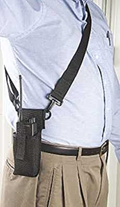 Man wearing should strap for radio holster