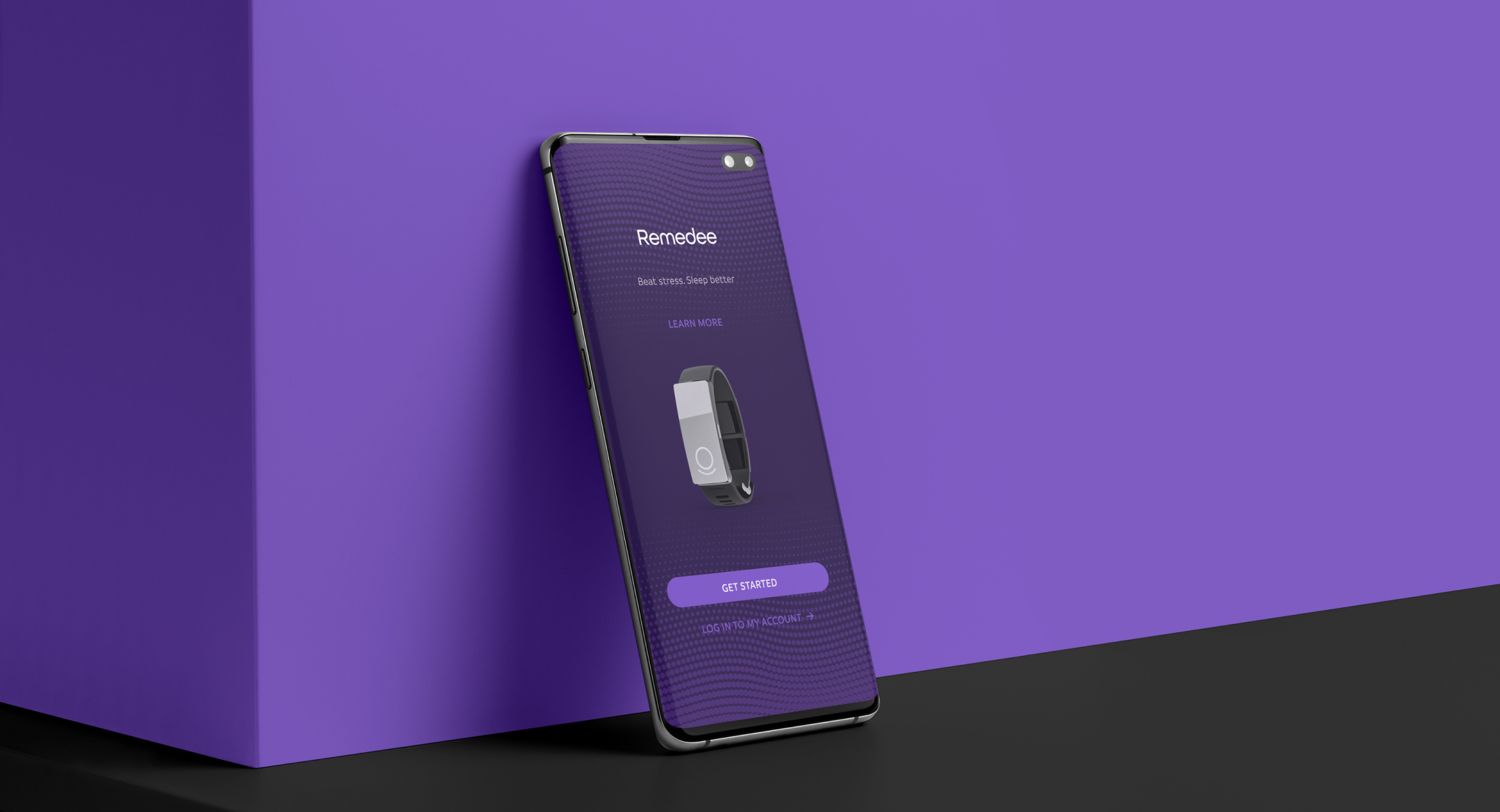 A smartphone against a purple background. On a phone screen, a screenshot from the Remedee app shows the Remedee wristband.