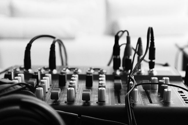 Black and white image of a sound panel with cords coming out of it