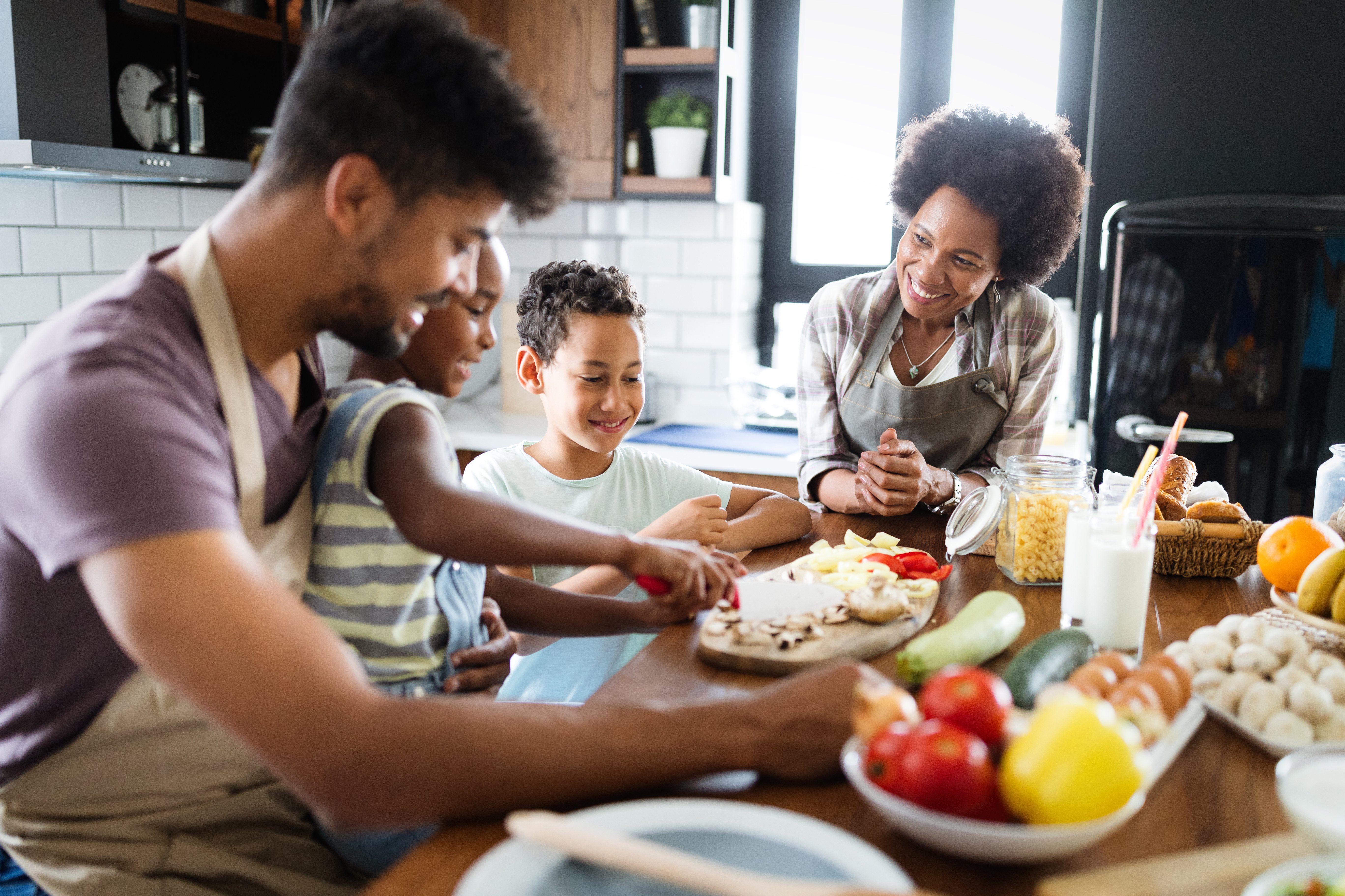 A young black family prepping a meal