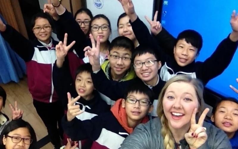 a female English teacher and her TEFL students