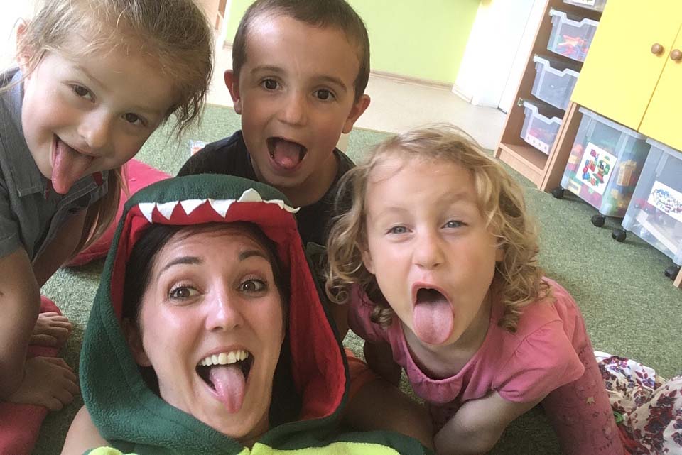 a female English teacher the Czech Republic with her students