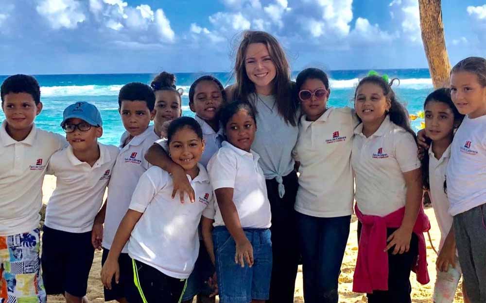 an English teacher in the Dominican Republic with her TEFL students