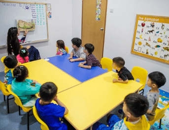 ESL teacher in Singapore with her students