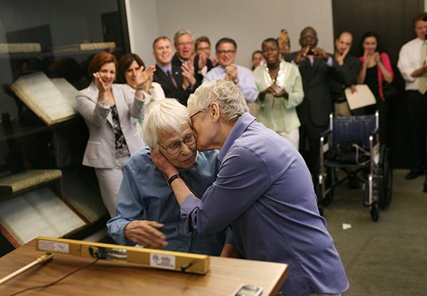 Phyllis Siegel, 76, kisses her wife Connie Kopelov, 84, after exchanging vows in front of New York City Council speaker Christine C. Quinn. The couple have been together for 23 years