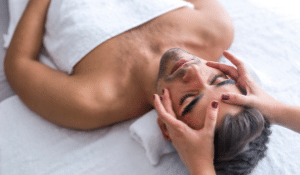 Hospitality-Man receiving a facial massage