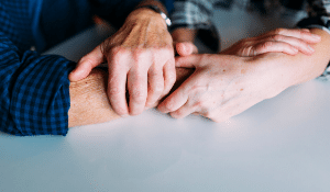 Seniors holding hands