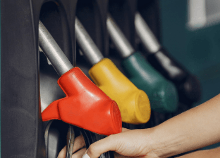 Photograph of petrol pumps in a row.