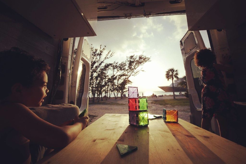 Boy and girl starting the day in the family van