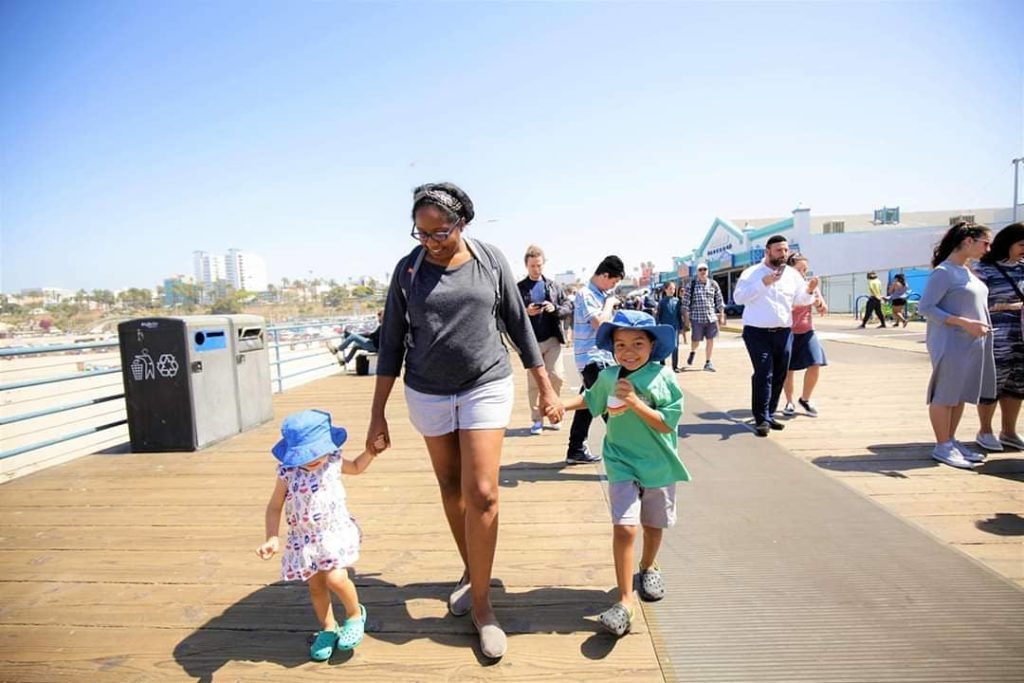 Mom and kids walking together.