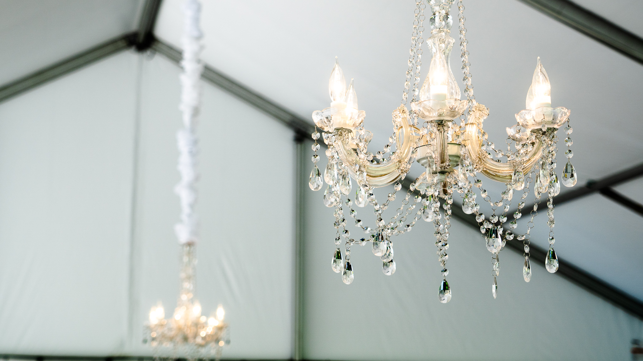 Chandeliers hanging in a tent.
