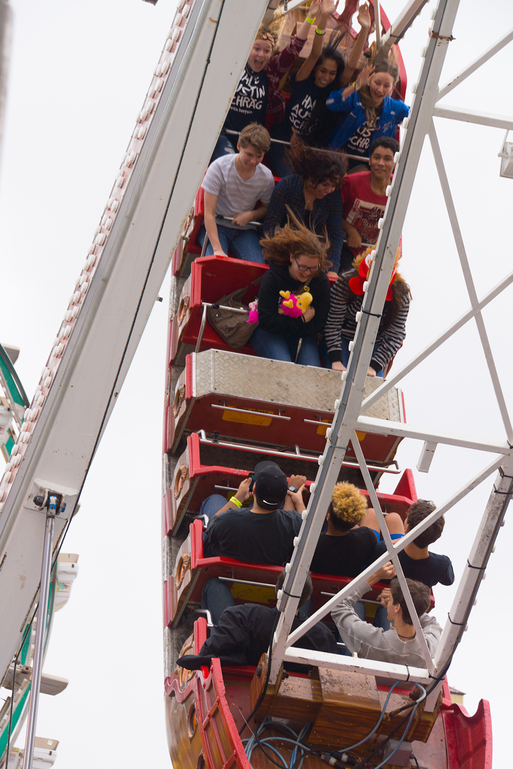 Students on a carnival ride during Students Day at Wurstfest